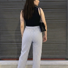 Close-up of folded hem detail in striped cotton pants