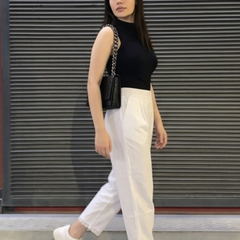 Close-up of lace detailing on white palazzo hem