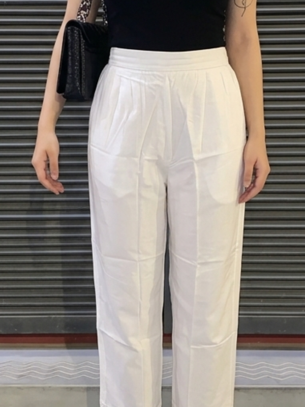 Model wearing white palazzo with kurta styling