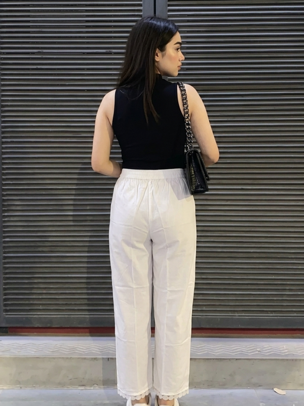 Back view of women white ethnic palazzo pants