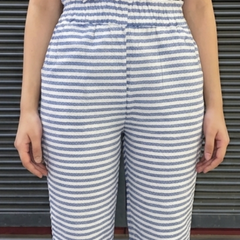 Model wearing white blue striped casual cotton pants