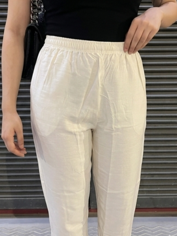 Model wearing white palazzo with kurta outfit