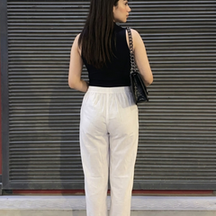 Back view of women white ethnic palazzo pants