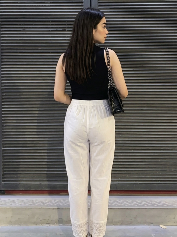 Back view of women white ethnic palazzo pants